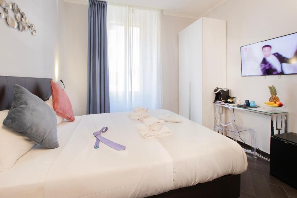 Postel nebo postele na pokoji v ubytování Cloud 9 Hotel
