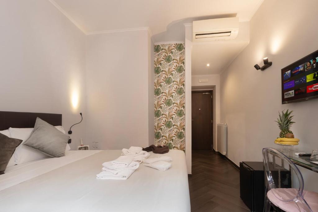 Postel nebo postele na pokoji v ubytování Cloud 9 Hotel