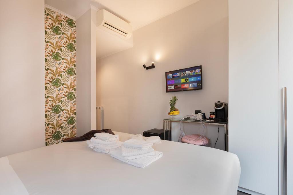 Postel nebo postele na pokoji v ubytování Cloud 9 Hotel