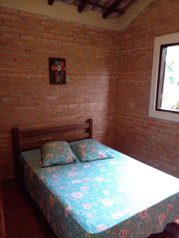 Postel nebo postele na pokoji v ubytování Chalé e Camping Elementais