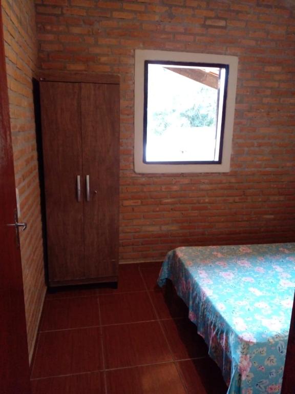 Postel nebo postele na pokoji v ubytování Chalé e Camping Elementais