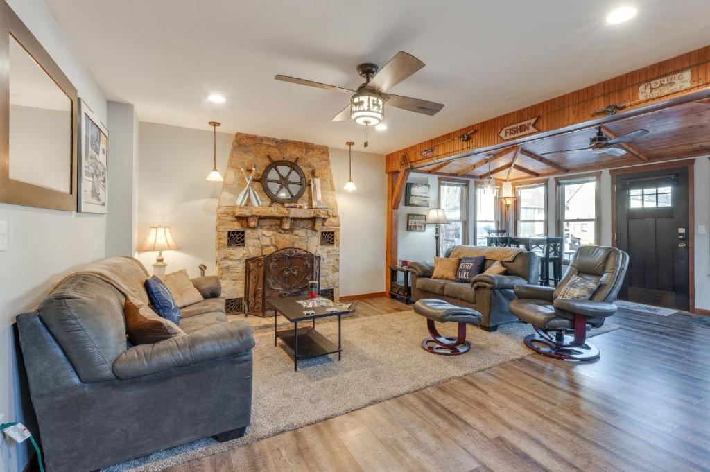 a living room with couches and a fireplace at Cozy Clear Lake Home - Walk to Town and Boat Dock! in Clear Lake
