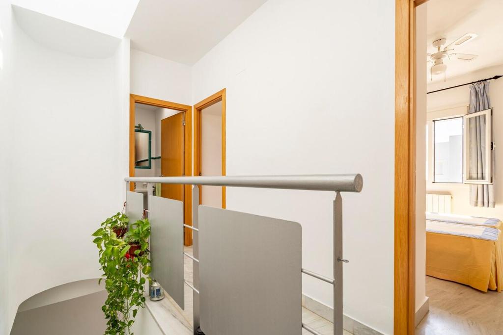 Postel nebo postele na pokoji v ubytování Casa Islantilla Real