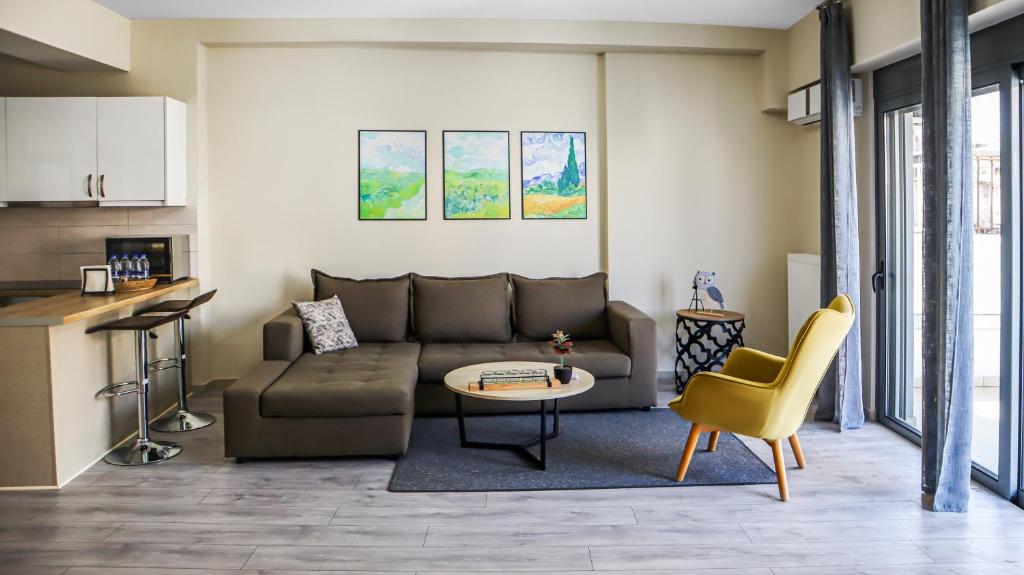 a living room with a couch and a table at Dafni City Apartment 2 in Athens