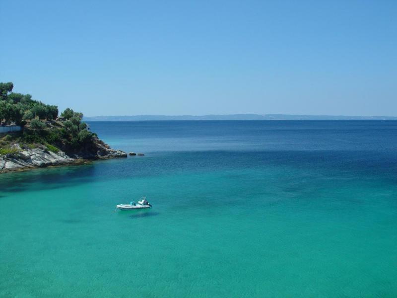 a boat in the middle of a large body of water at Spathies in Kalogria