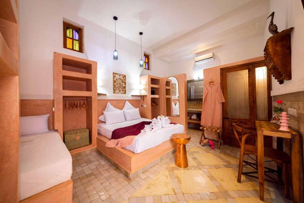 Postel nebo postele na pokoji v ubytování Riad Ambre et Jasmin
