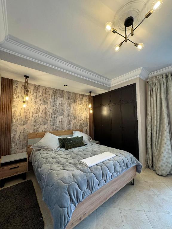 Een bed of bedden in een kamer bij Studio Plage Malabata tanger