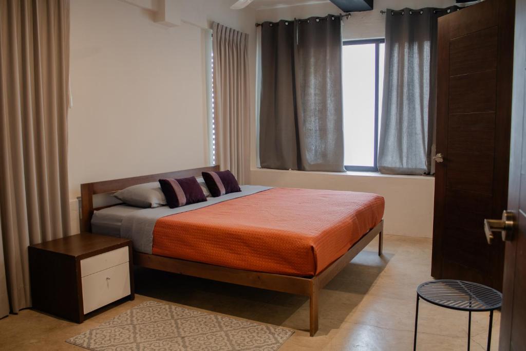 Postel nebo postele na pokoji v ubytování Casa Kuxul