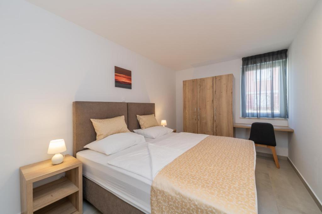 Posteľ alebo postele v izbe v ubytovaní A&V Residence