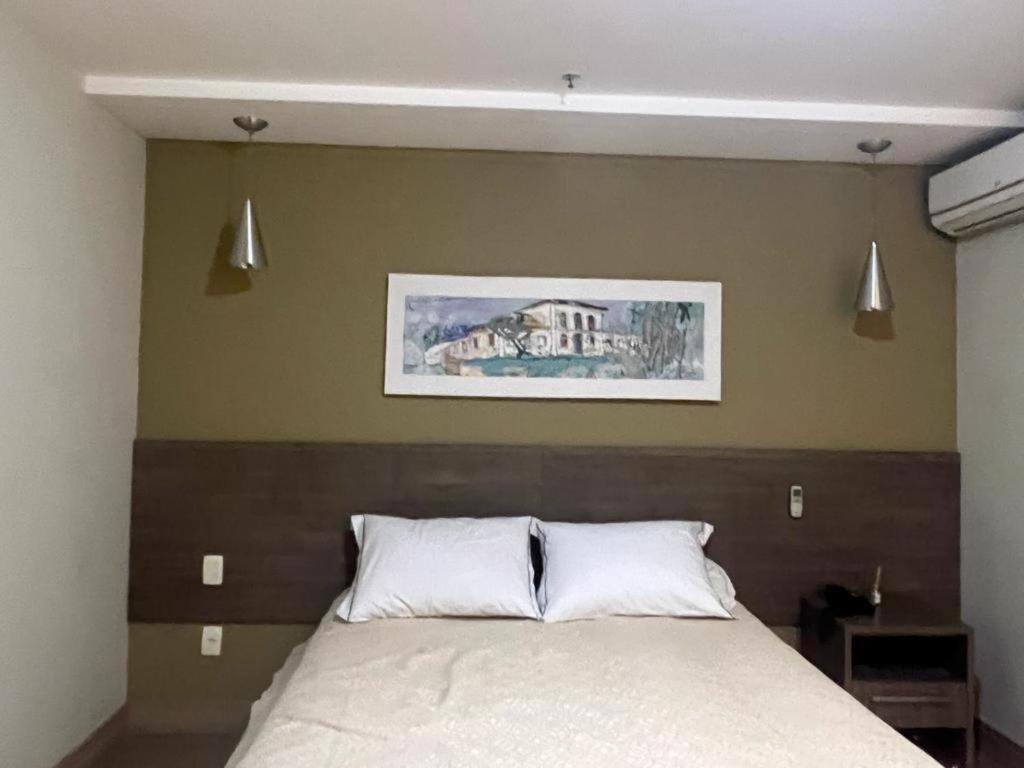 Un pat sau paturi într-o cameră la Alugo 1 Suite 210 no Mont Blanc