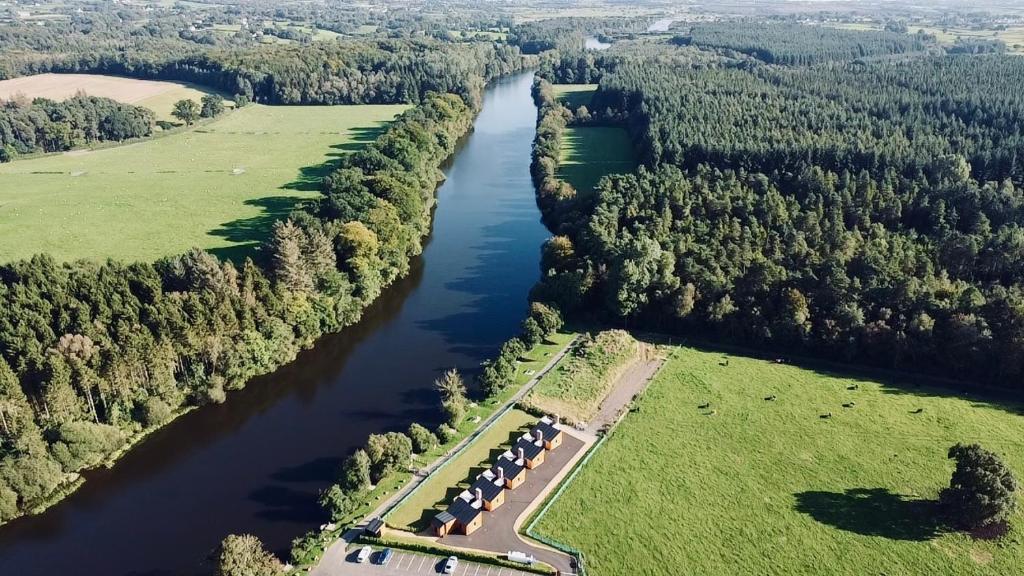 an aerial view of a river with trees at River Bann Retreat in Portglenone