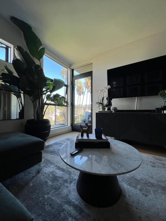 a living room with a coffee table and a couch at Center of Hollywood in Los Angeles