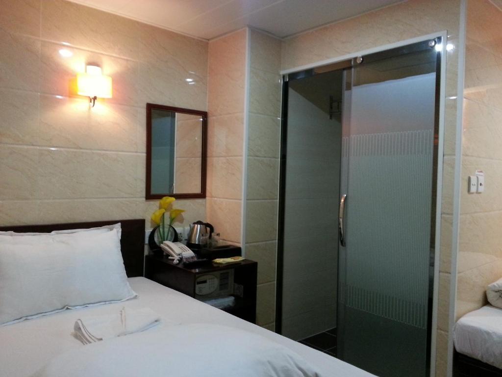 Voodi või voodid majutusasutuse Sun Guest House toas