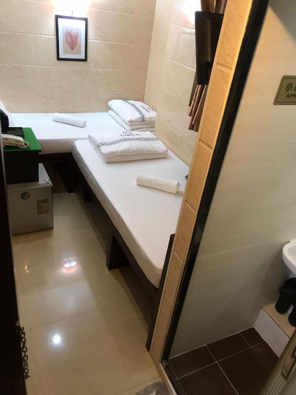 Voodi või voodid majutusasutuse Sun Guest House toas