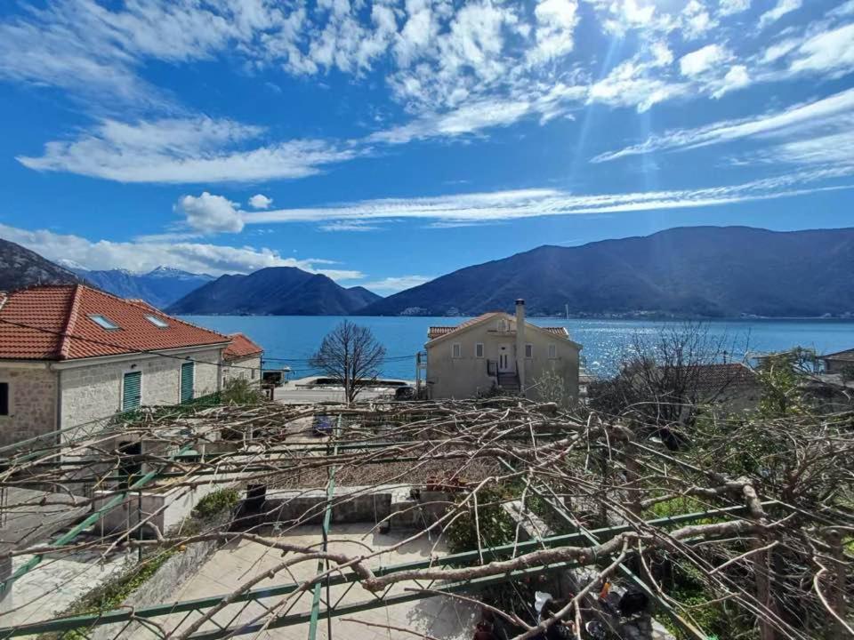 a house with a view of the water and mountains at villa branka in Strp