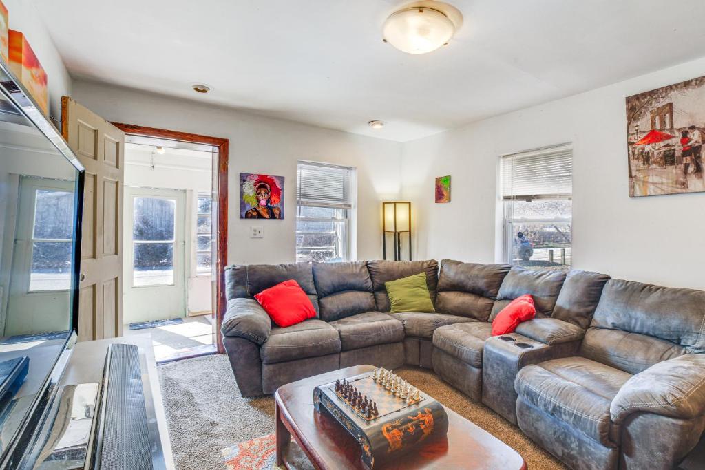 a living room with a couch and a table at Dog-Friendly Michigan City Home - 3 Mi to Beach! in Michigan City