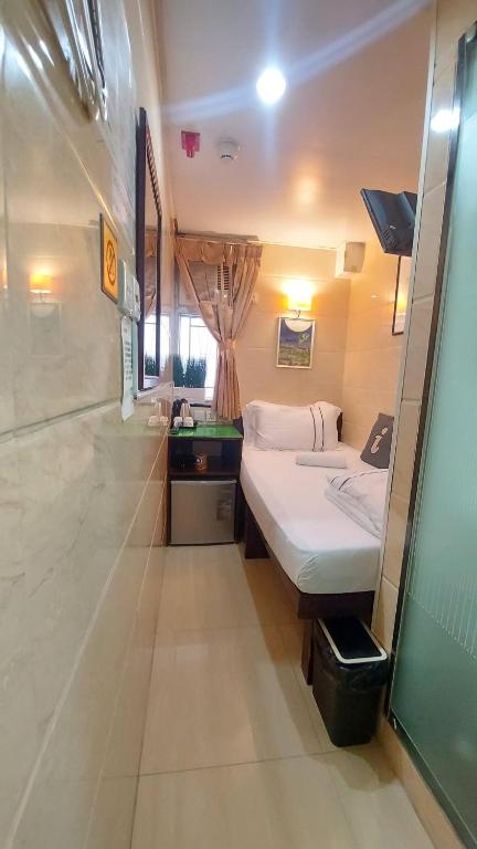 Voodi või voodid majutusasutuse Sun Guest House toas