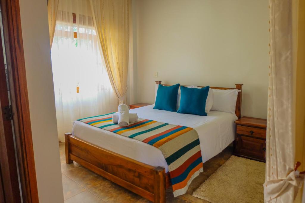 Postel nebo postele na pokoji v ubytování Hotel Gran Sirius