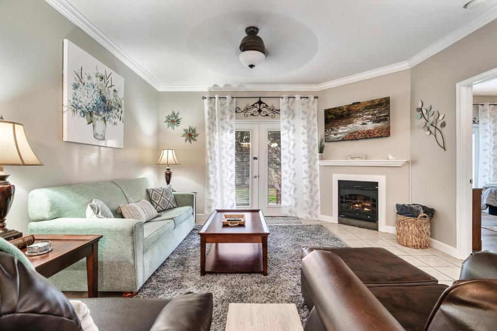 a living room with a couch and a fireplace at Luxury Condo, Sleeps 6, 3.2 Miles to Dollywood in Pigeon Forge