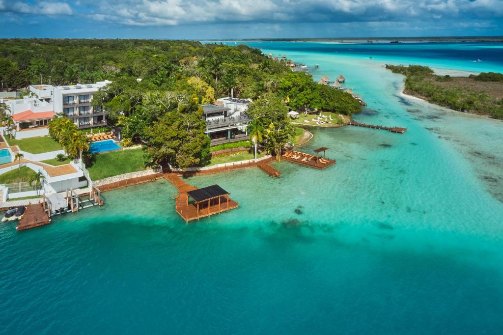 an aerial view of an island in the water at Cristalino Lagoon Front Hotel, Restaurant & Spa in Bacalar