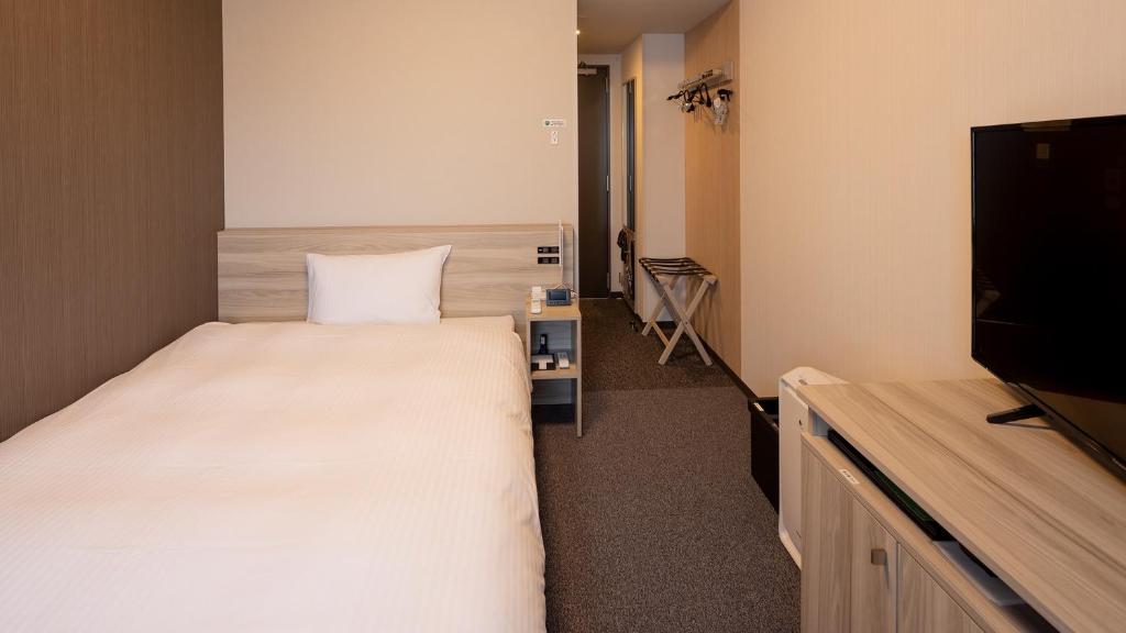 TV a/nebo společenská místnost v ubytování Hotel Route Inn Imabari