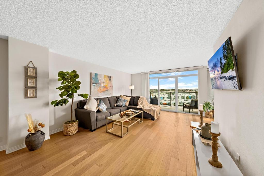 a living room with a couch and a table at The tulip Marina Highrise with ocean view in Los Angeles