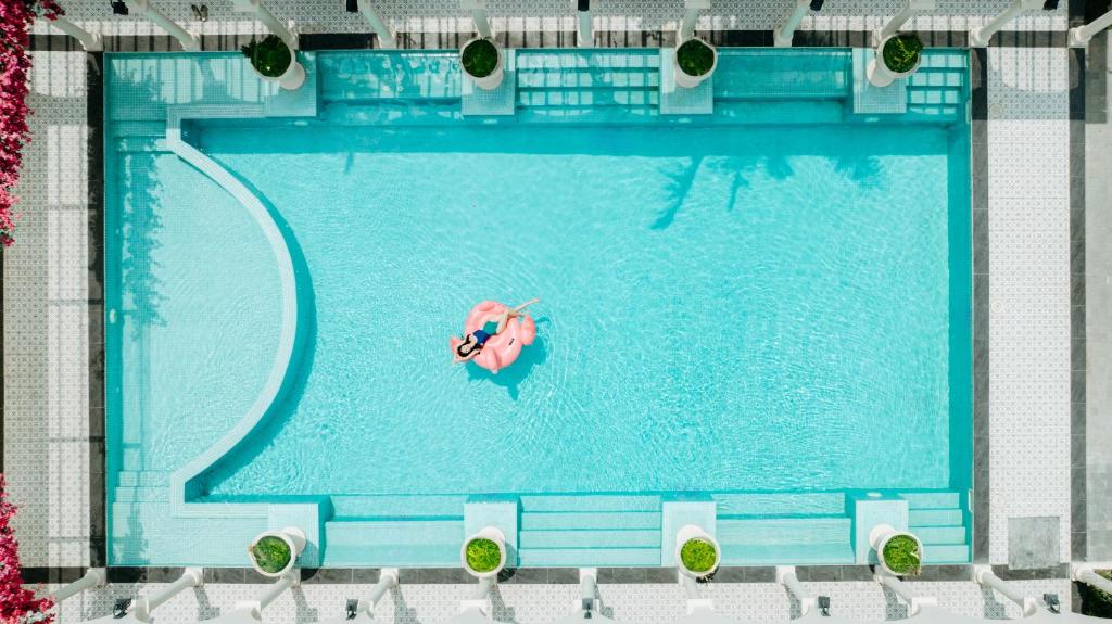an overhead view of a swimming pool with a life preserver at The Residence Resort & Villas Phu Quoc in Phu Quoc