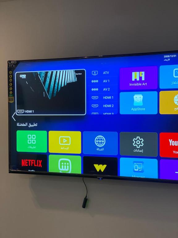 TV a/nebo společenská místnost v ubytování RAAK HOTEL فندق راك