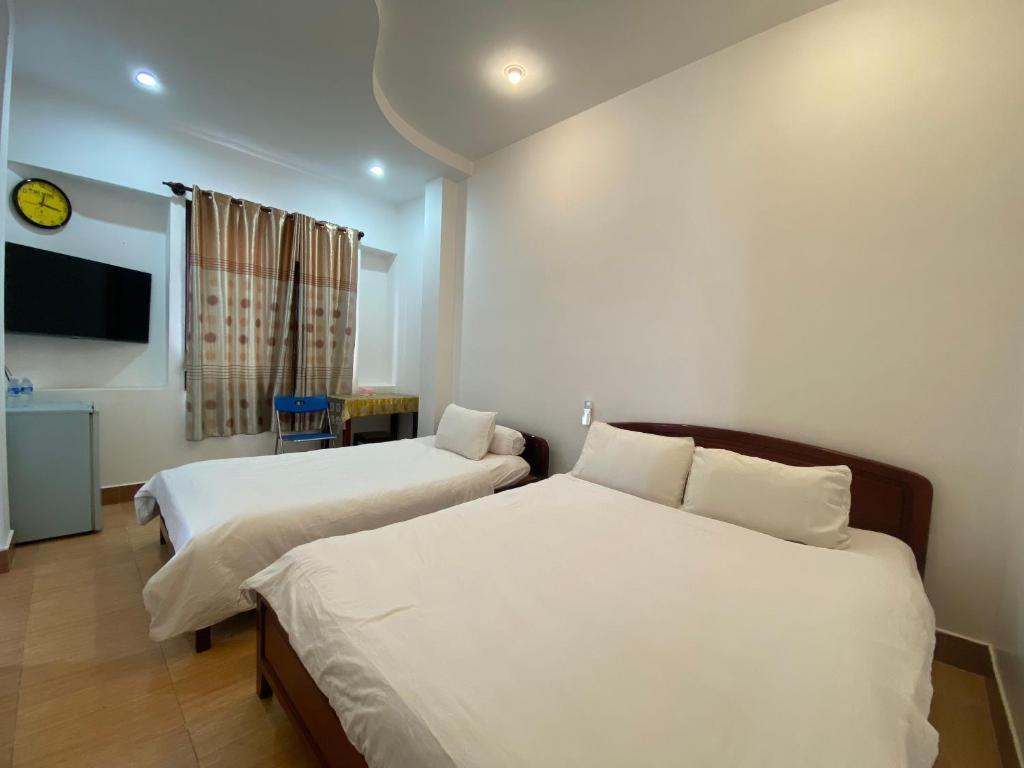 Giường trong phòng chung tại Du Hung 1 Hotel
