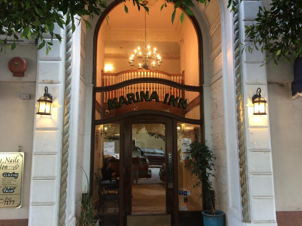 an entrance to a restaurant with a chandelier above the door at Marina Inn in San Francisco