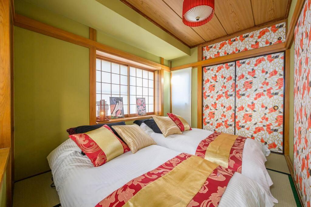 Säng eller sängar i ett rum på Premier suite Nishiazabu Roppongi front