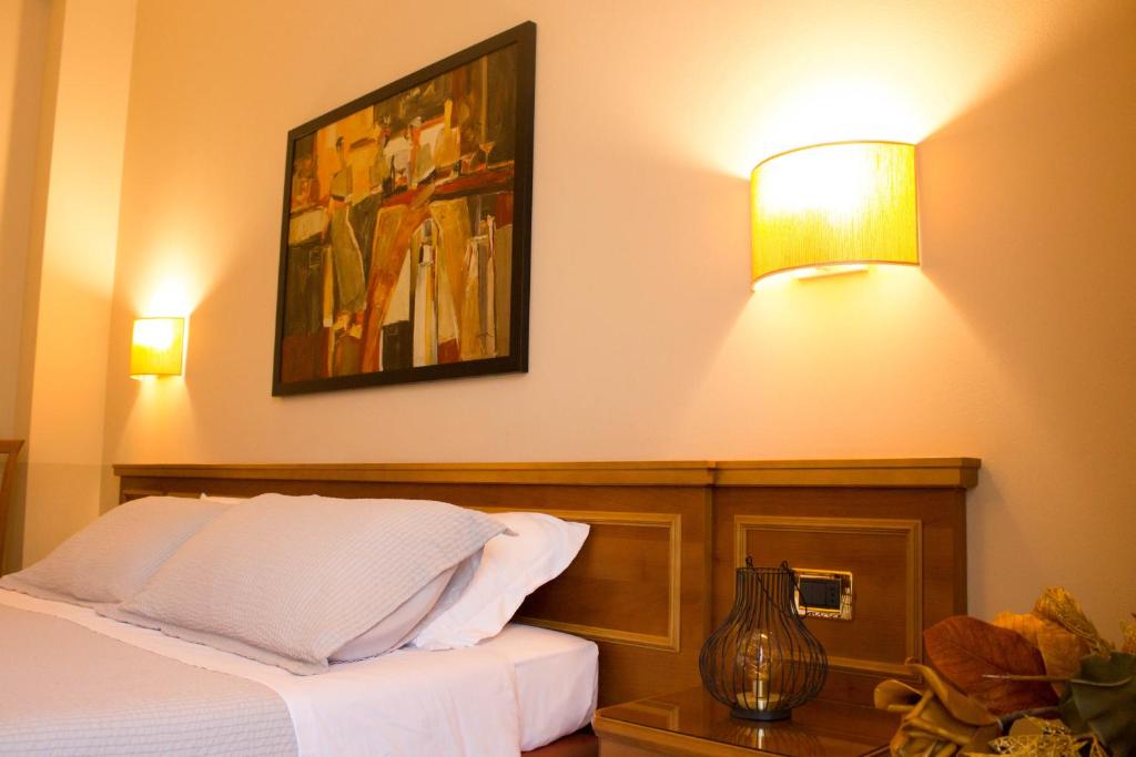 Postel nebo postele na pokoji v ubytování Hotel Valentino
