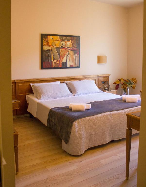 Postel nebo postele na pokoji v ubytování Hotel Valentino