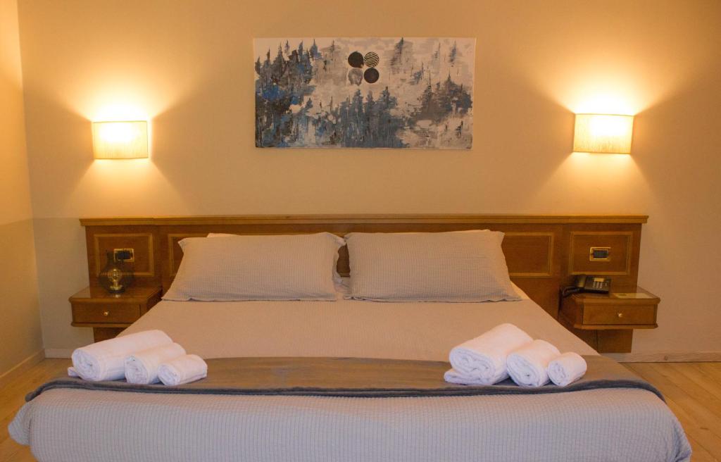 Postel nebo postele na pokoji v ubytování Hotel Valentino