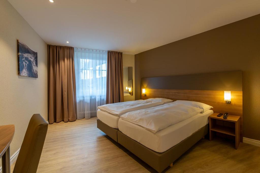 Voodi või voodid majutusasutuse Hotel Kronenhof toas