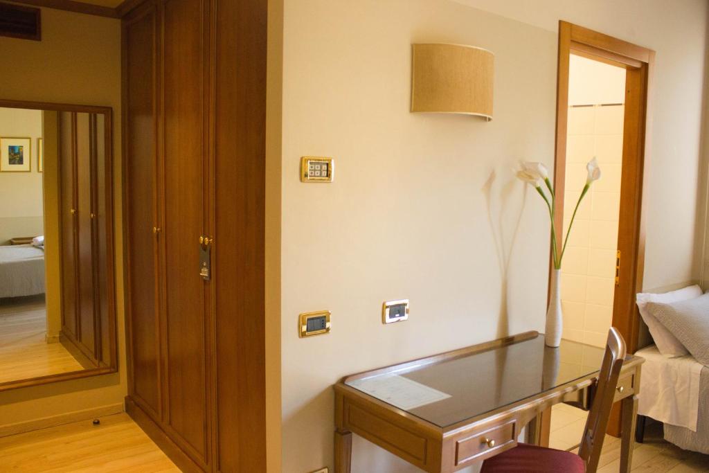 Postel nebo postele na pokoji v ubytování Hotel Valentino