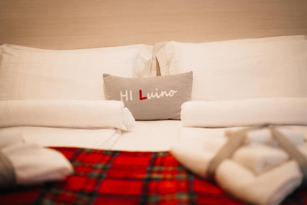 Postel nebo postele na pokoji v ubytování Hotel Internazionale Luino