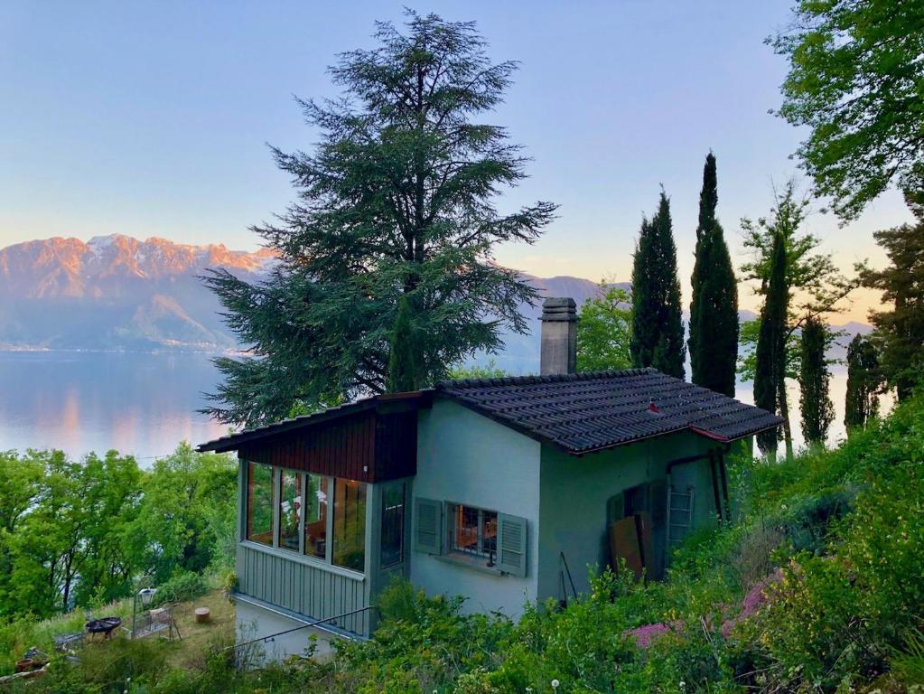 a small house on the side of a hill at Lovely villa in Lavaux with unique view ! in Chardonne