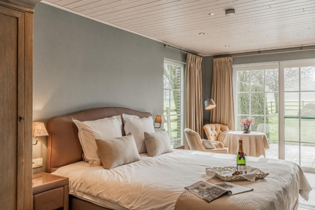 Postel nebo postele na pokoji v ubytování B&B De Bergvallei