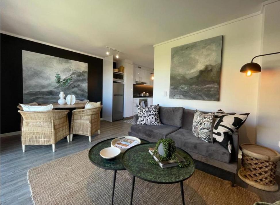 a living room with a couch and a table at Castle Rock Apartment in Cape Town