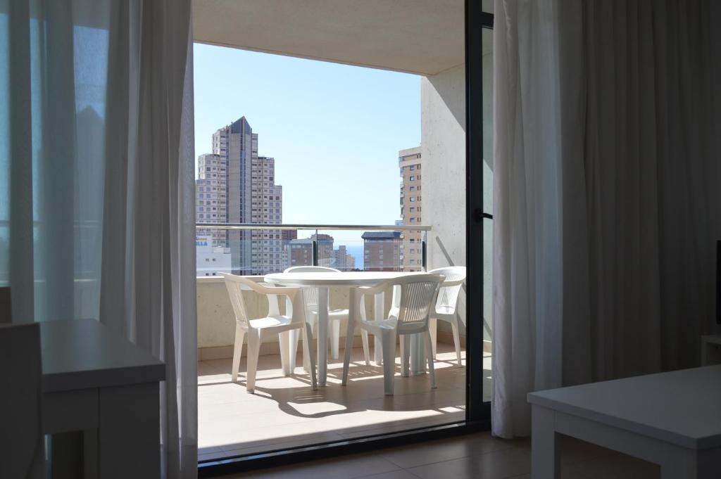 Hotel D'OBOE Marlovi Apt with pool, a view of a table and chairs on a balcony at D'OBOE Marlovi Apt with pool in Benidorm