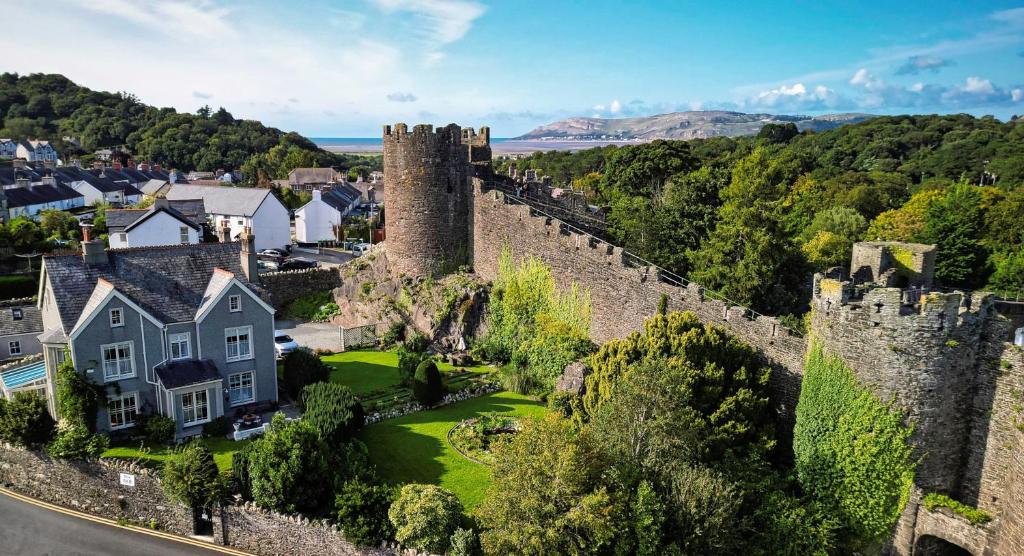 an aerial view of a castle in a town at Bryn Guest House in Conwy