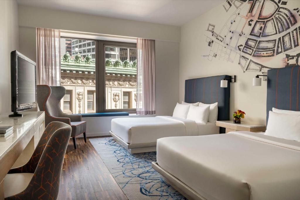 a hotel room with two beds and a window at Hyatt Centric Wall Street New York in New York