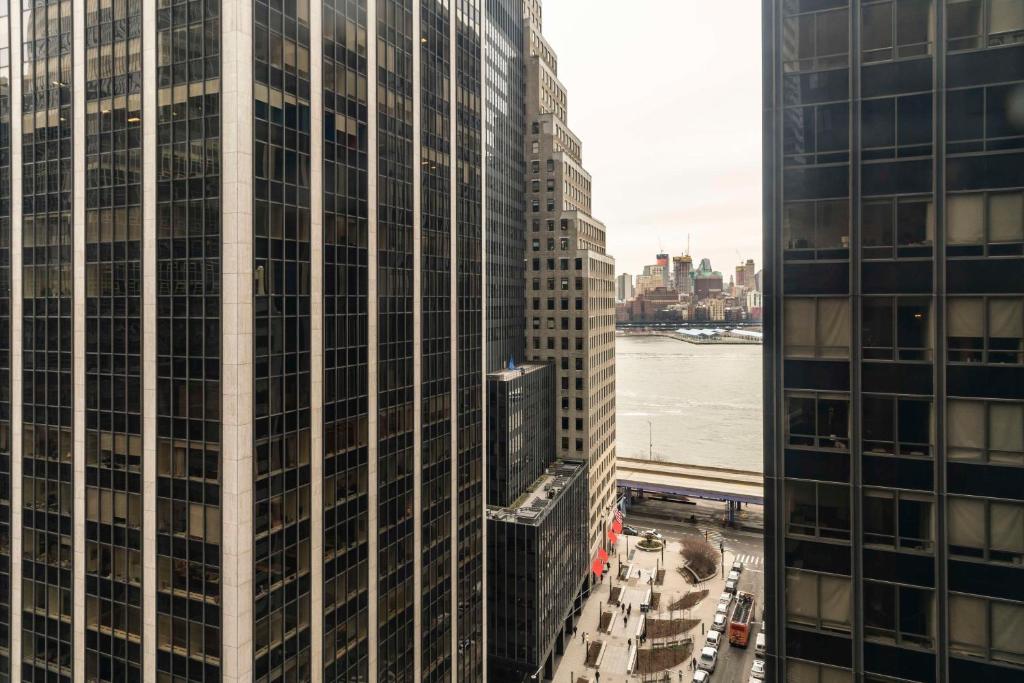 an aerial view of two tall buildings in a city at Hyatt Centric Wall Street New York in New York