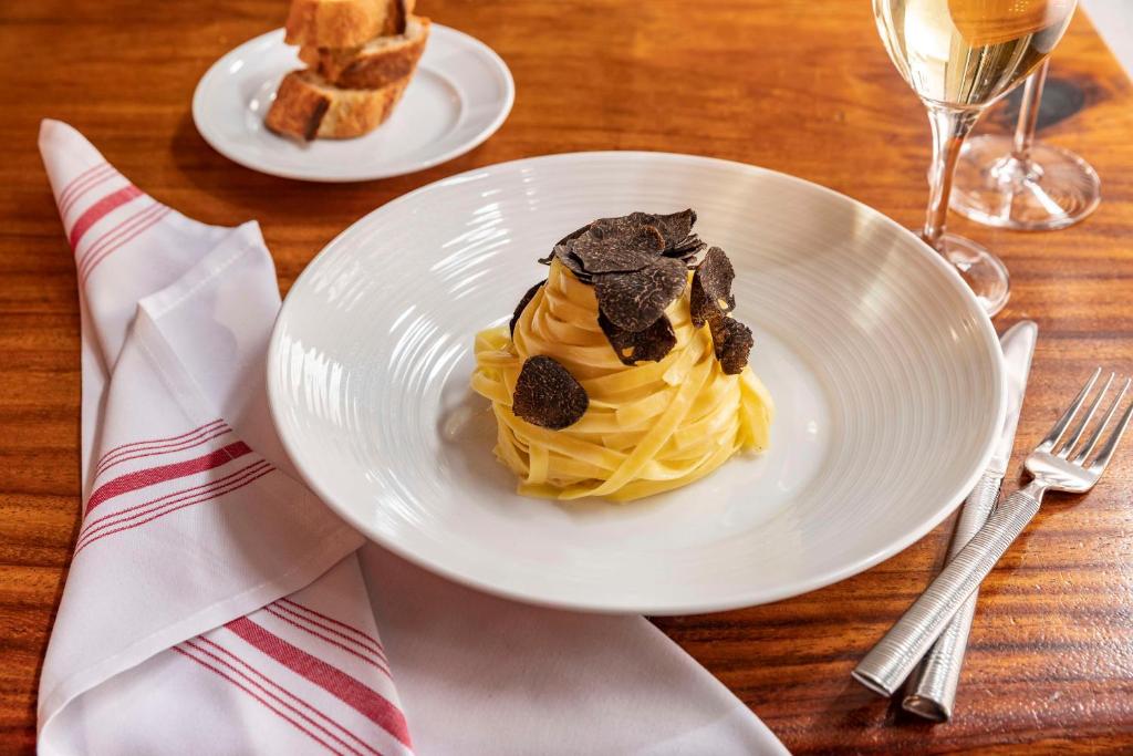 a white plate with a dessert on a table at Hyatt Centric Wall Street New York in New York
