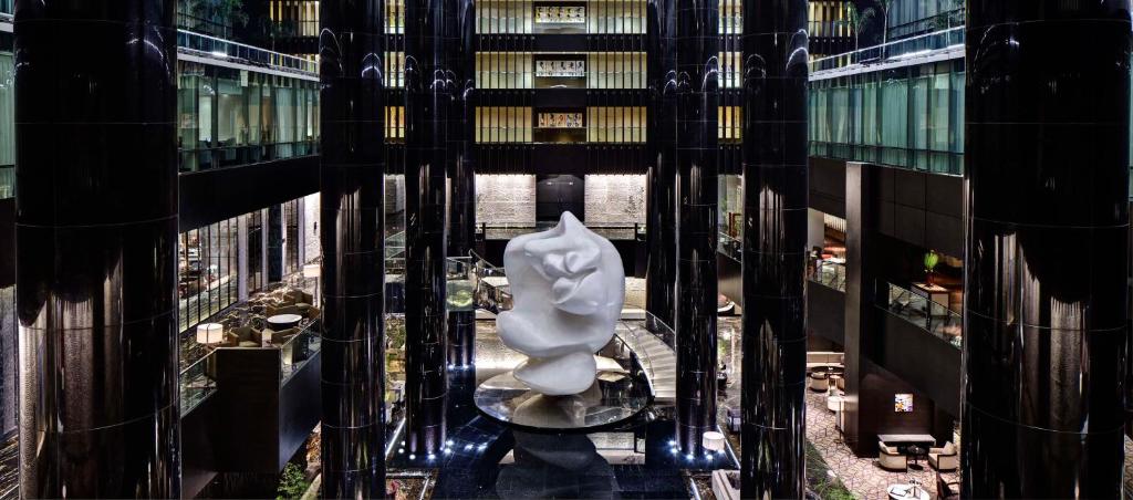 a large white statue in the middle of a building at Park Hyatt Hotel and Residences, Hyderabad in Hyderabad