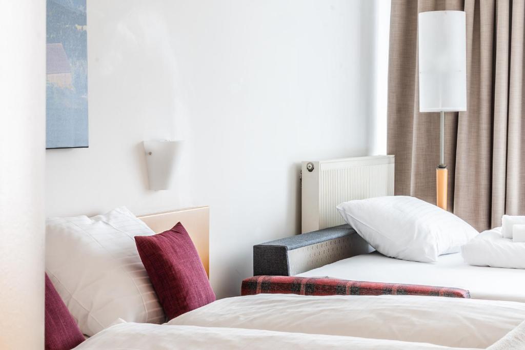 Postel nebo postele na pokoji v ubytování Hotel Löwen