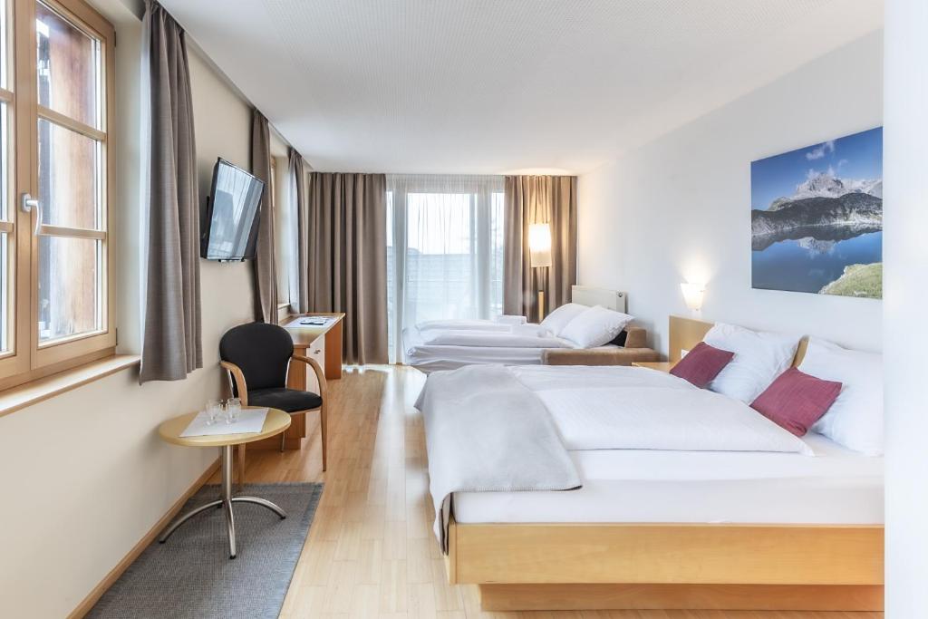 Postel nebo postele na pokoji v ubytování Hotel Löwen
