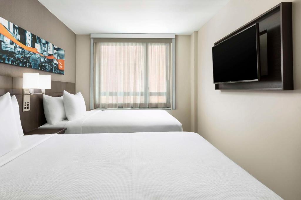 Postel nebo postele na pokoji v ubytování Hyatt Place New York City - Times Square
