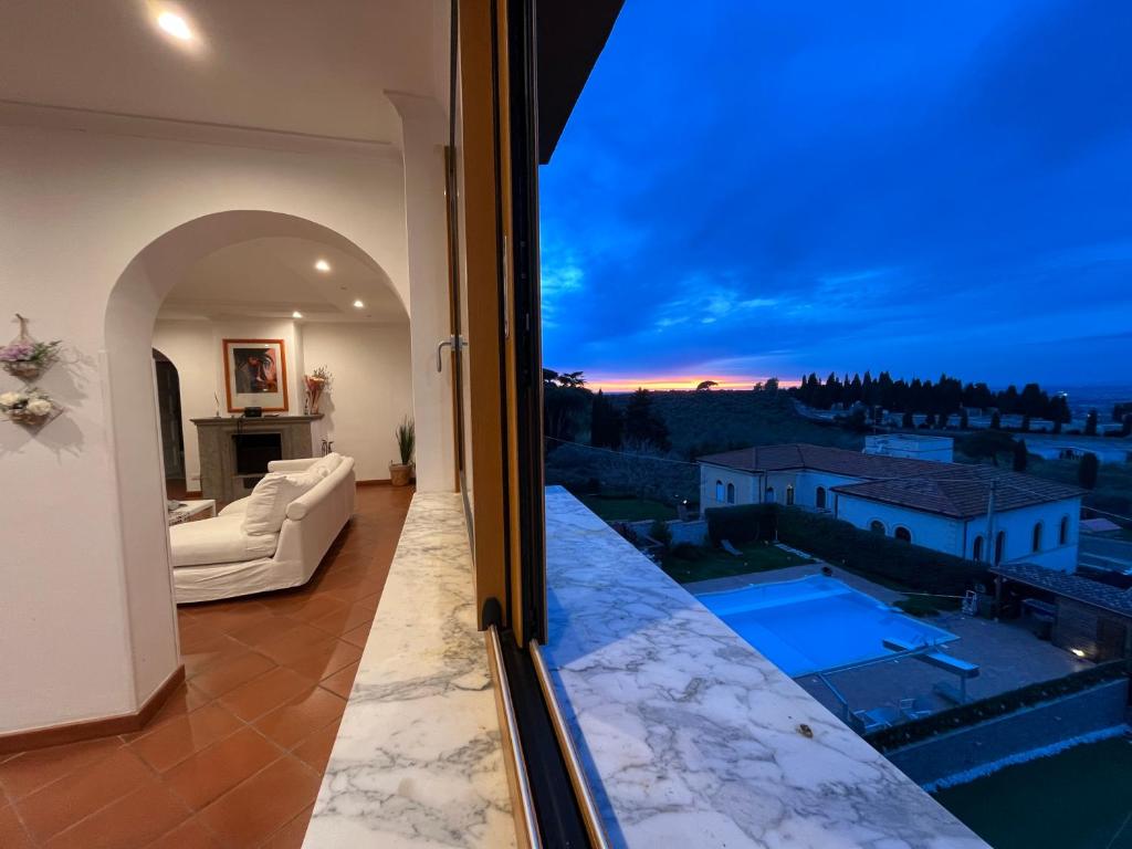 a room with a view of a living room at Le terrazze di Dany (attico su Roma) in Frascati